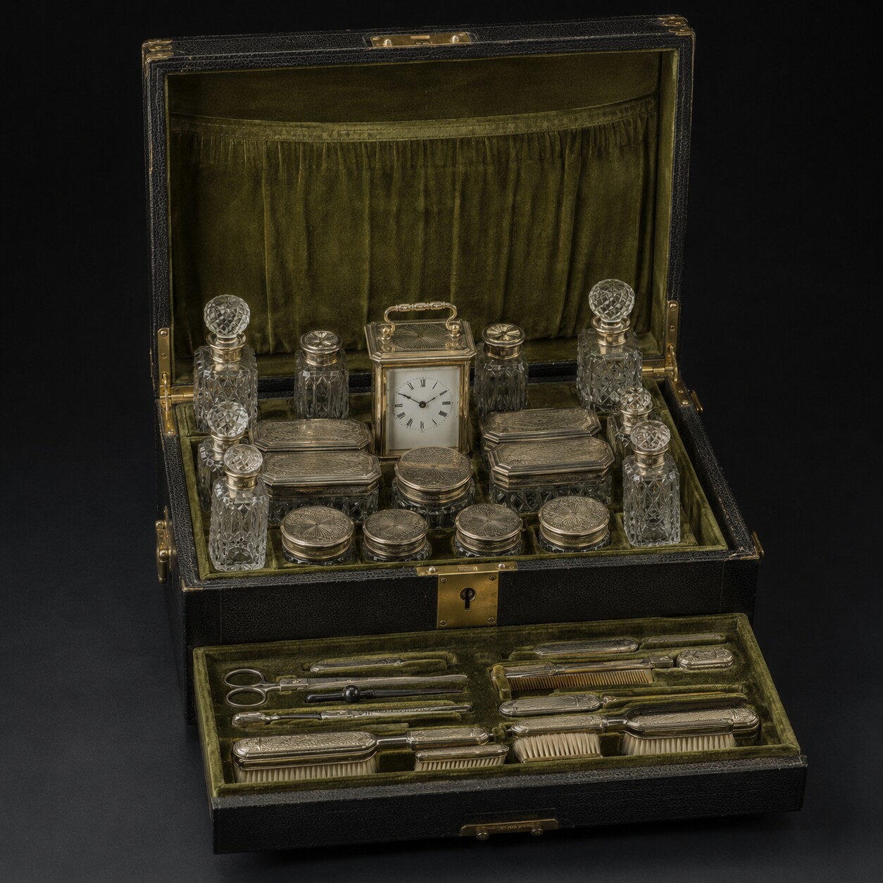 Editorial reconstruction of an open black leather travelling case with an olive fitted interior, silver-mounted glass vessels, a carriage clock and grooming tools.
