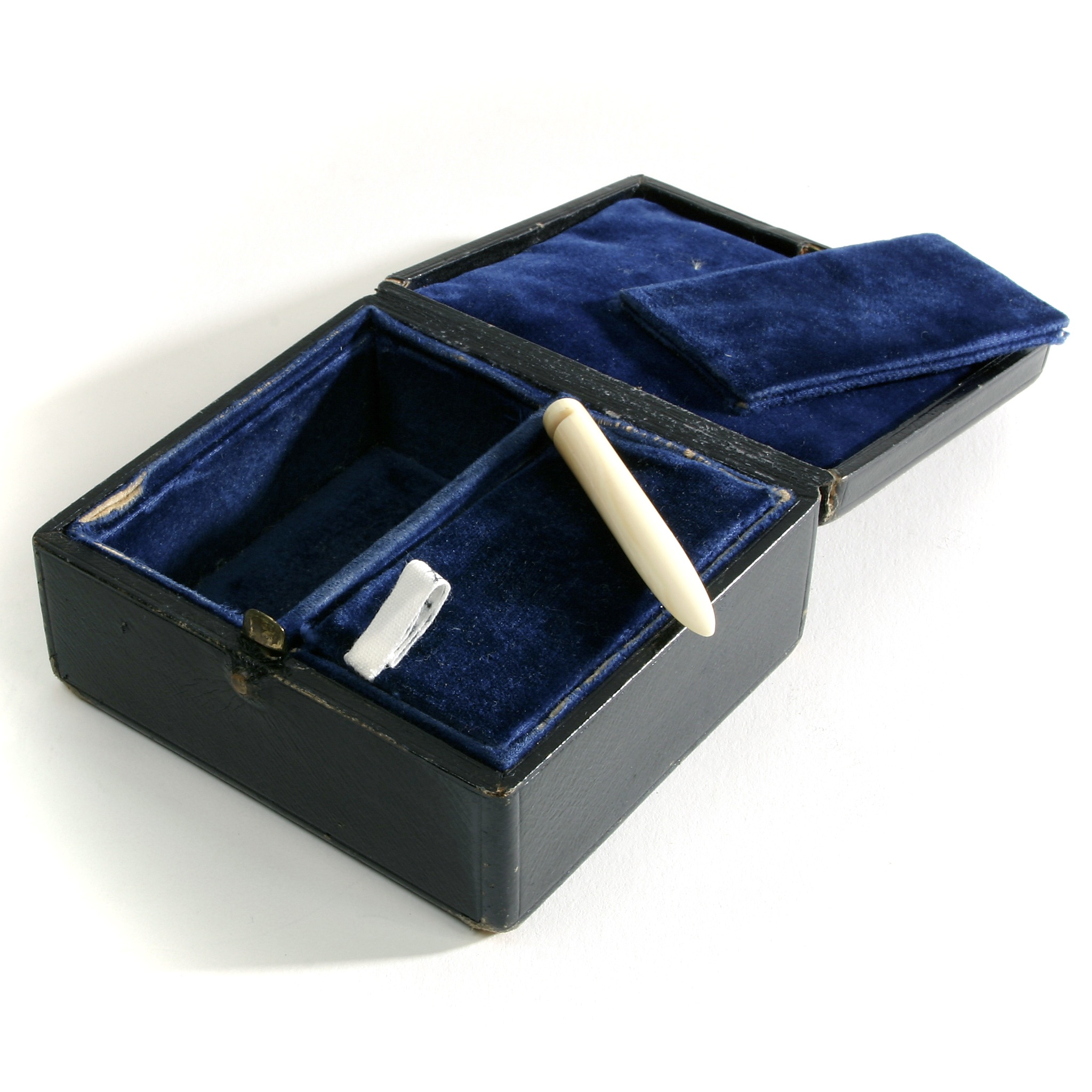 Open black-leather jewellery case with blue velvet lining, two fitted compartments and removable pads.