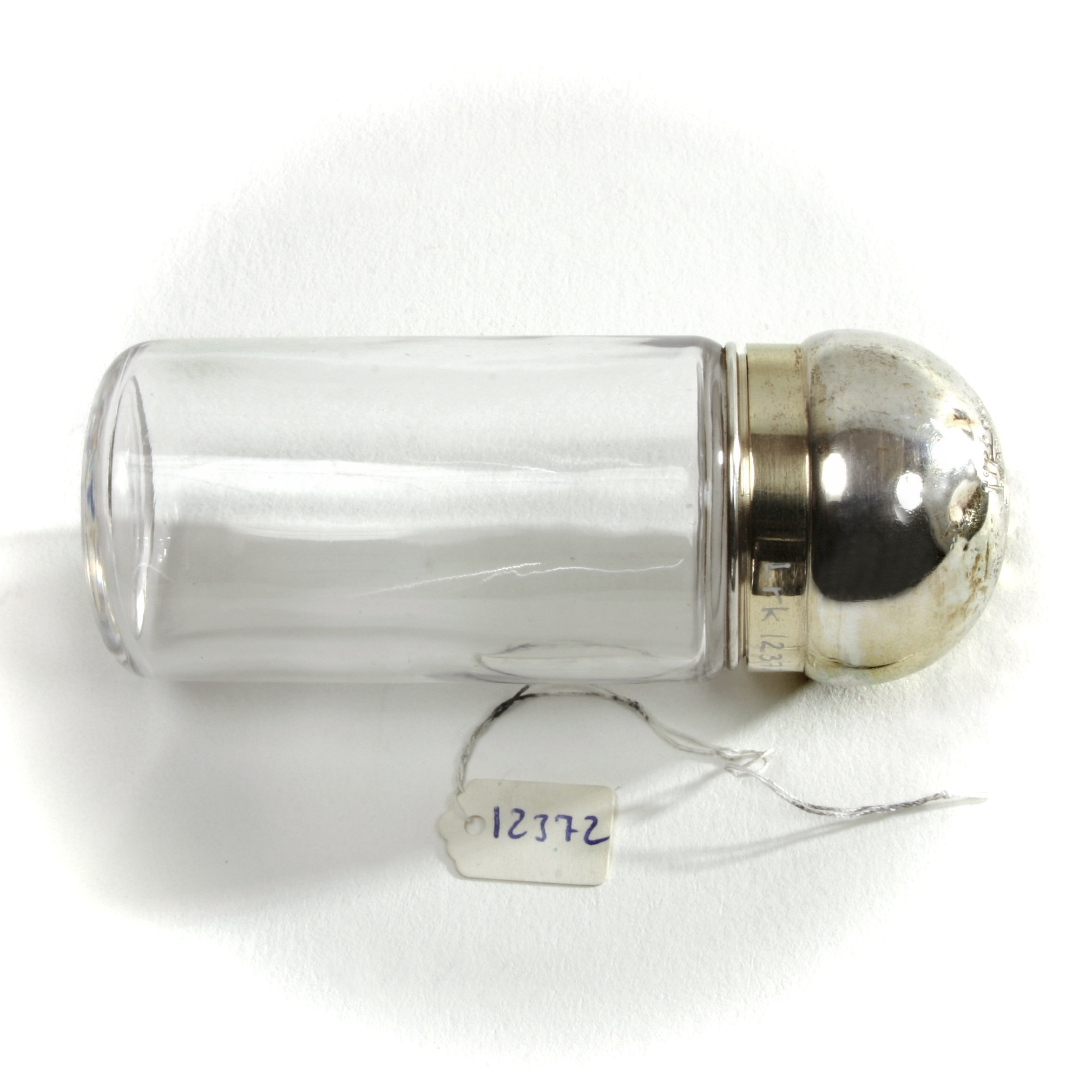 Round glass jar with a silver-gilt screw cover and crowned G monogram.
