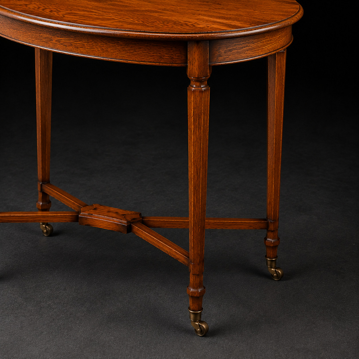 Editorial detail of an oak table apron, stretcher, leg and bronze caster.